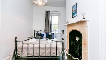 1 bedroom, desk, iron/ironing board, travel crib