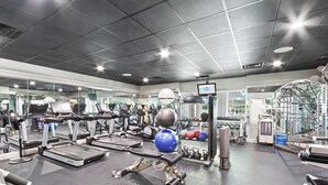 A gym with treadmills, exercise balls, and weight machines. - Luxury 3 Bed 3 Bath Resort Beaches Pool Golf (Gulf Shores)