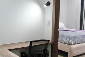 Superior Apartment, City View | Desk, laptop workspace, blackout curtains, iron/ironing board - Seis Residences (Quito)