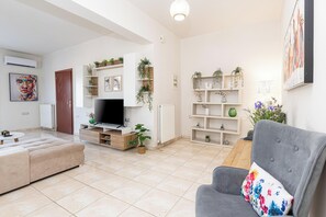 Superior Apartment, Mountain View | Living area | 50-inch Smart TV with cable channels