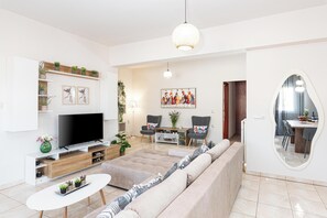 Superior Apartment, Mountain View | Living area | 50-inch Smart TV with cable channels