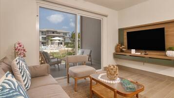 Premium Villa, Garden View | Living area | 50-inch Smart TV with cable channels