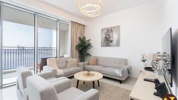 Luxury Apartment, Balcony, Canal View | Living area | 65-inch Smart TV with cable channels