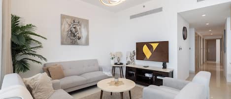 Luxury Apartment, Balcony, Canal View | Living area | 65-inch Smart TV with cable channels