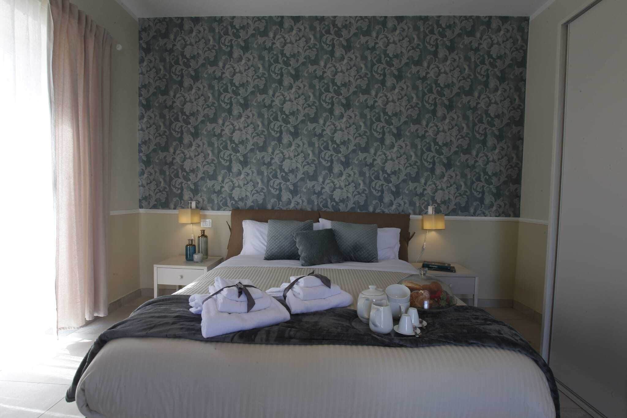 Deluxe Quadruple Room, Garden View | Laptop workspace, free WiFi