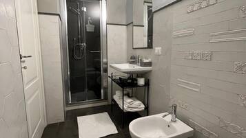 Deluxe Double Room, Garden View | Bathroom | Shower, hair dryer, towels, soap