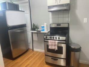 A kitchen with a stainless steel refrigerator, an oven, and a microwave. - 2 Bedroom Cozy Accomodation (Windsor)