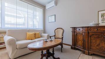 Basic Apartment, Balcony | Living area | 35-cm TV with digital channels