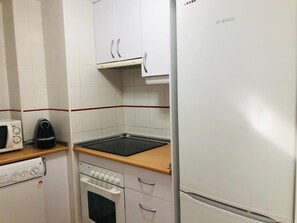 Fridge, microwave, oven, stovetop - Apartment 'Apartamento Luz De Baria' with Shared Pool, Private Terrace and Air Conditioning (Vera)