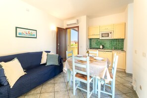 Apartment, 1 Bedroom, Balcony | Dining room - Calm Escape in Seaside Resort (Palau)
