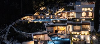 Luxury villa with infinity salt pool featuring a waterfall and gorgeous seaviews