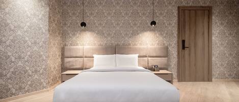 A modern bedroom with a large bed, two bedside tables, a wooden door, and patterned wallpaper.