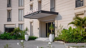 A hotel entrance with a sign reading "atlantiblu Hotels & Resorts". - Atlanticblu Hotels & Resorts (Abuja)