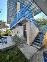 Habitación doble, vistas parciales al mar | Zona de estar