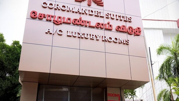 A hotel entrance with a sign reading "Coromandel Suites" and "A.C. Luxury Rooms". - Coromandel Suites (Chennai)