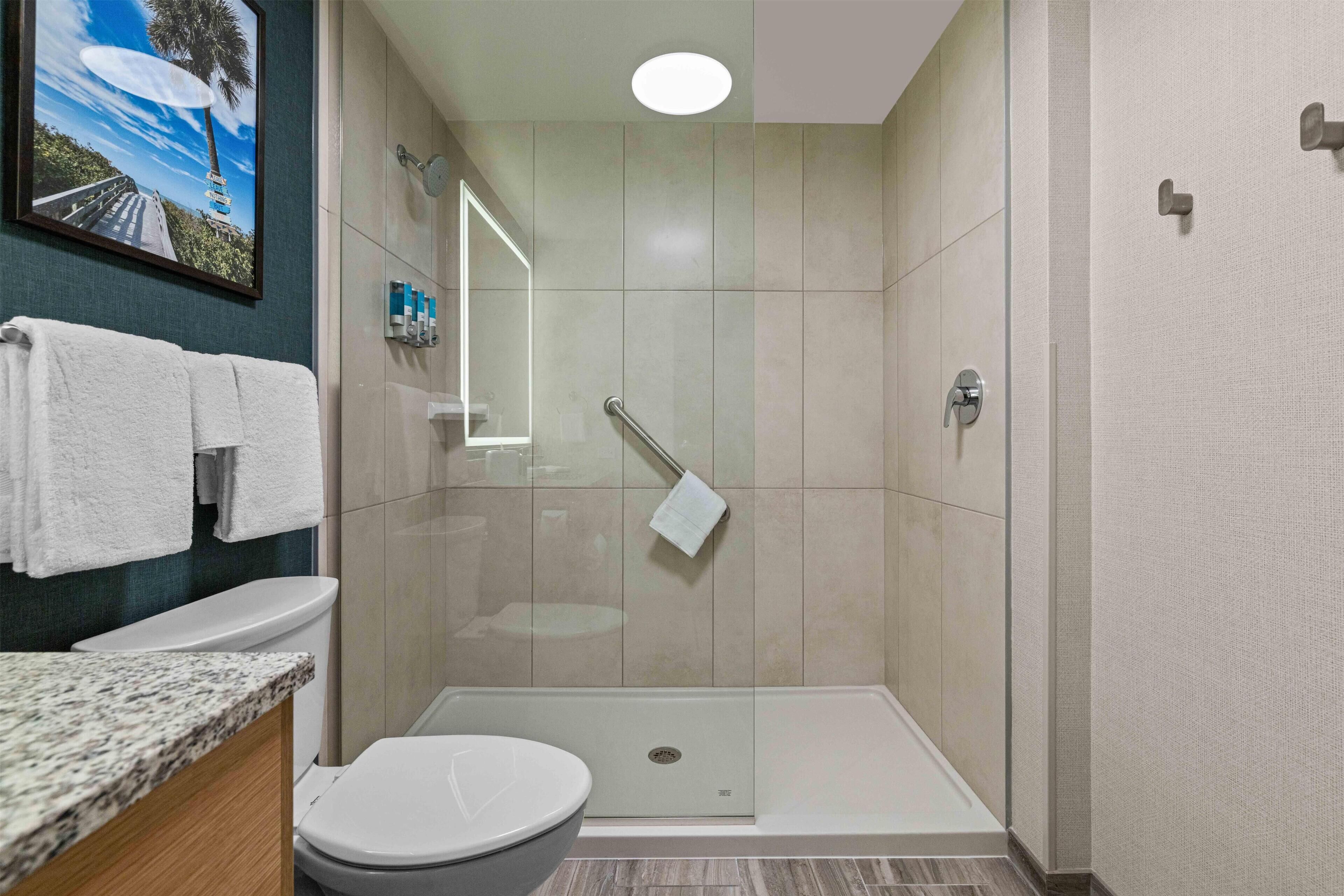 Shower, hair dryer, towels, soap