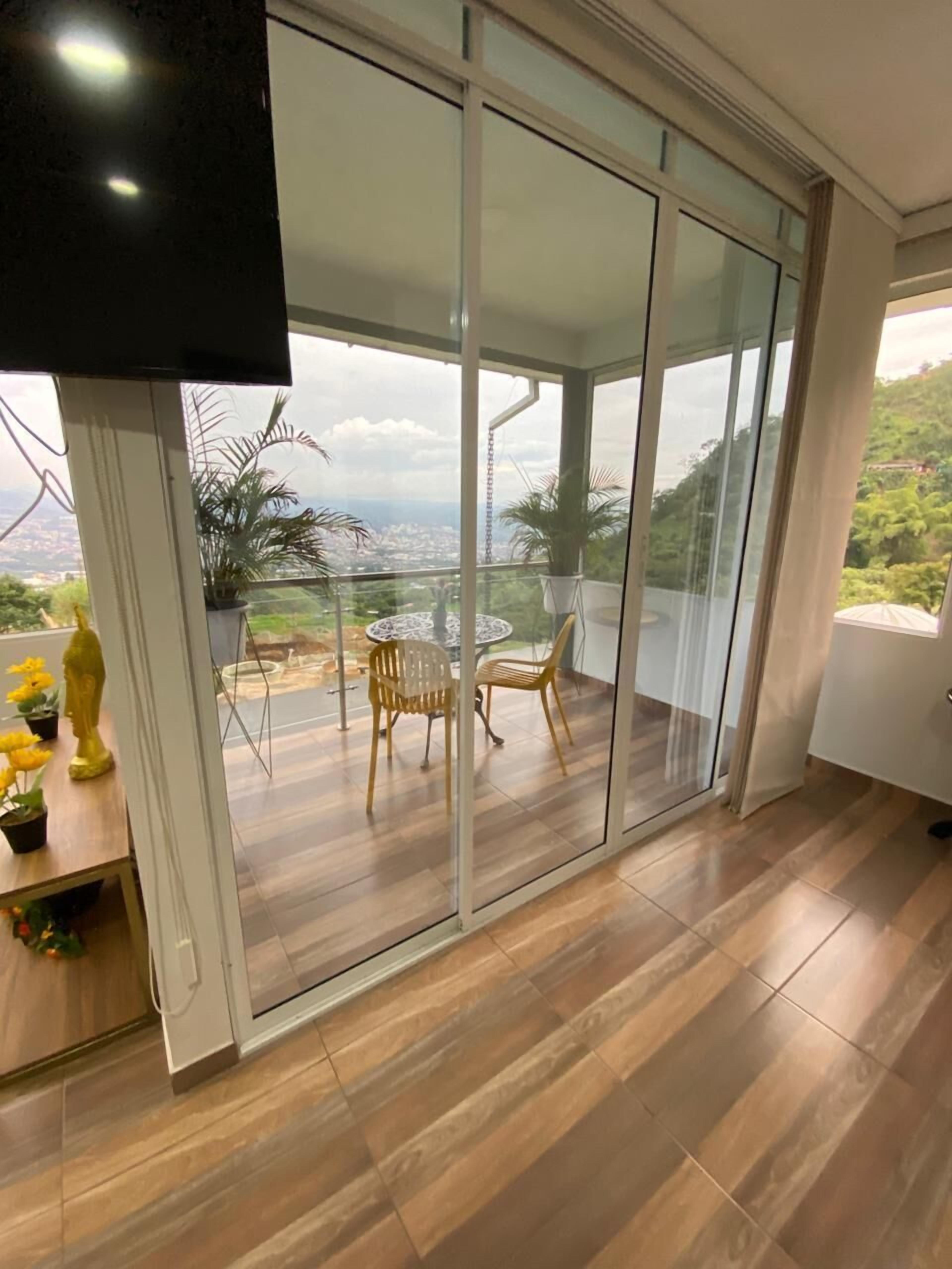 Comfort Quadruple Room, Balcony, City View | Living area