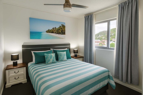 Comfortable queen bed with hotel-quality linen