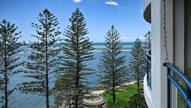 A balcony with a view of the ocean and trees. - It's Five O'Clock Somewhere (Sunshine Coast)