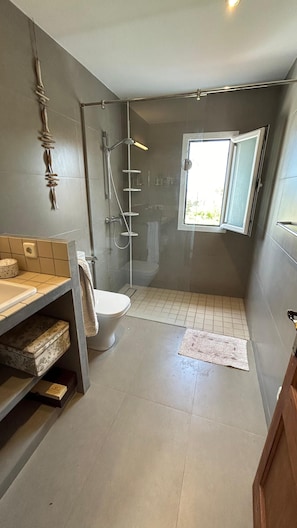 Shower, hair dryer, towels, soap