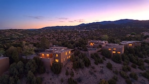 A residential area with multiple houses, surrounded by trees and hills. - Casa de Azulejos (Santa Fe)