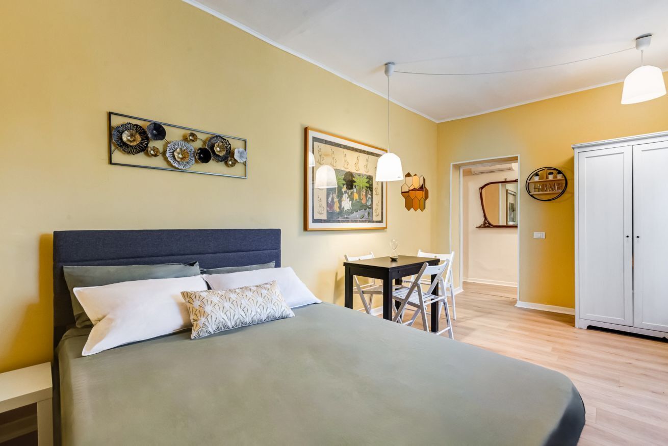 Desk, iron/ironing board, travel cot