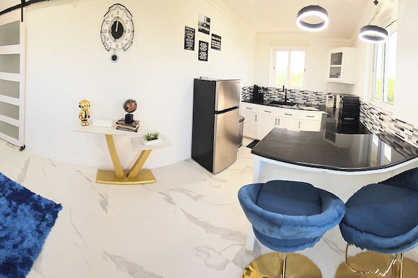 Pano view of the kitchen and living room area. Note the 50" TV is in the MBR.