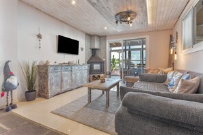 TV, fireplace - Apartment with Sea View and Pool, Wi-Fi Included (La Sabinita)