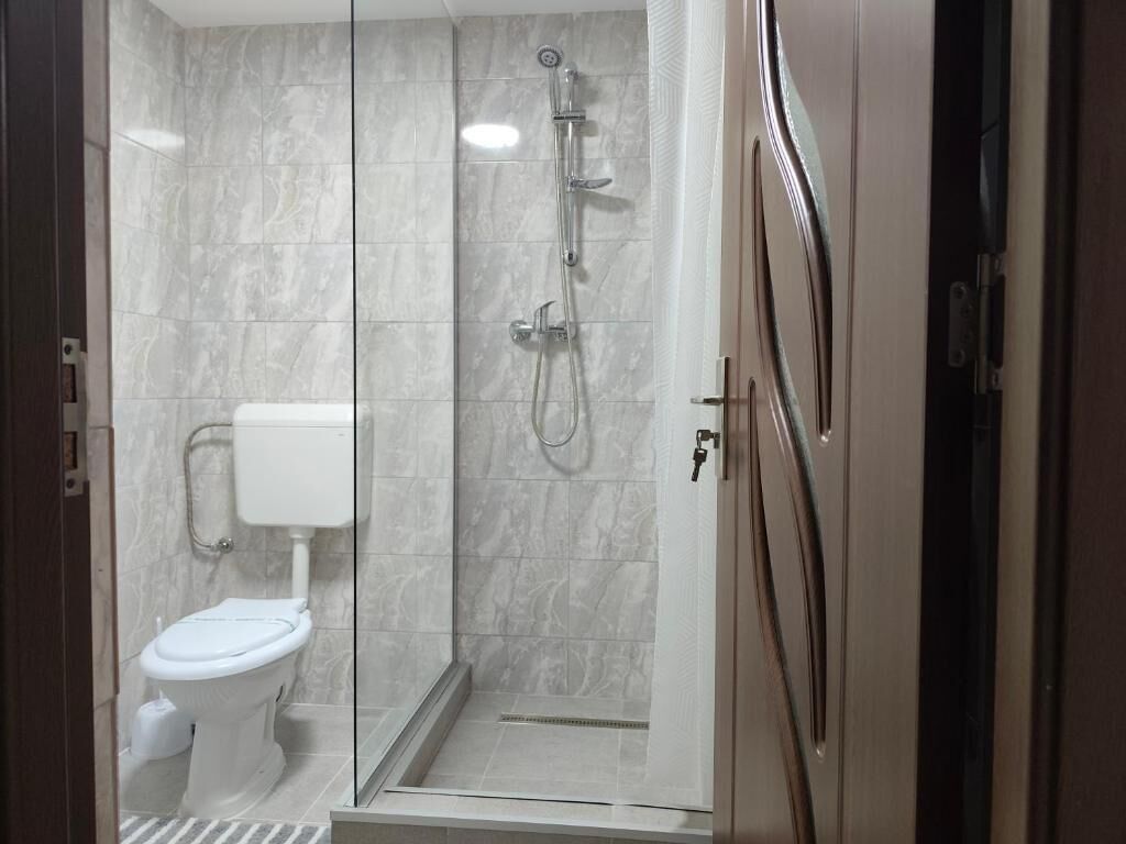 Family Room, Balcony, Courtyard View | Bathroom | Shower, free toiletries, hair dryer, towels