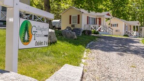 A sign for Gallagher's Cabins 3-6, indicating a campground with cabins.