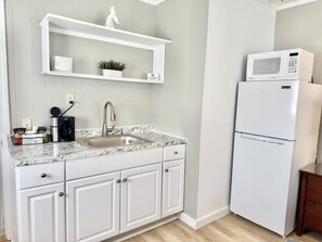 Microwave, stovetop, coffee/tea maker, cookware/dishes/utensils