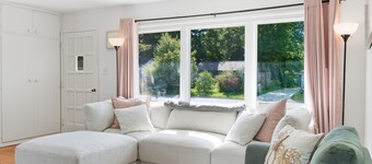 Bright, cozy 3BR ranch in Lake Country with fenced yard and covered patio.