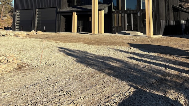 A modern building with a large garage and a covered outdoor area. - RY Place: Relax. Refresh. Repeat. (Mountain Home)