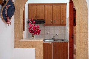 Family Studio, Partial Ocean View | Private kitchen | Mini-fridge, stovetop, cookware/dishes/utensils - Irene Studios Patmos (Skala)