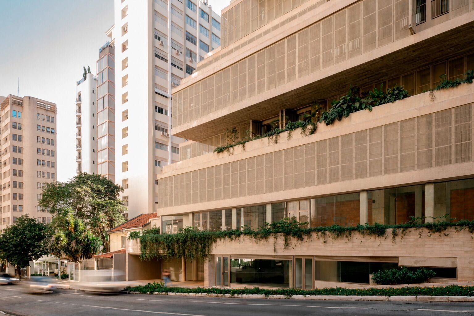 A multi-story building with large windows and a flat facade.