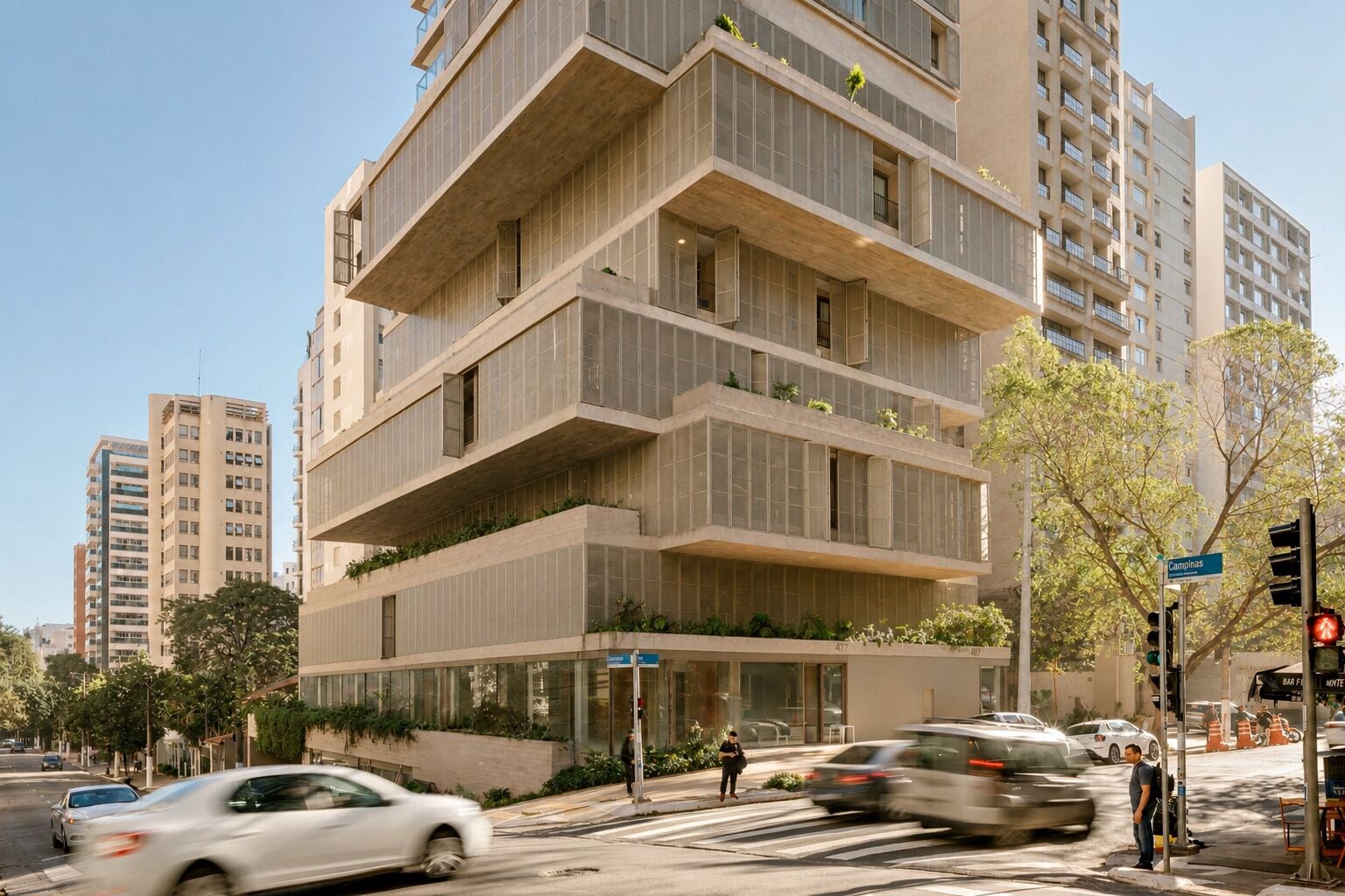 A multi-story building with a modern architectural design, featuring balconies with greenery, a street view with cars and a pedestrian crossing, and a clear sky.