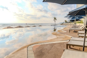 Outdoor pool, pool umbrellas, sun loungers