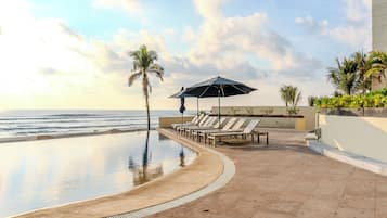 Outdoor pool, pool umbrellas, sun loungers