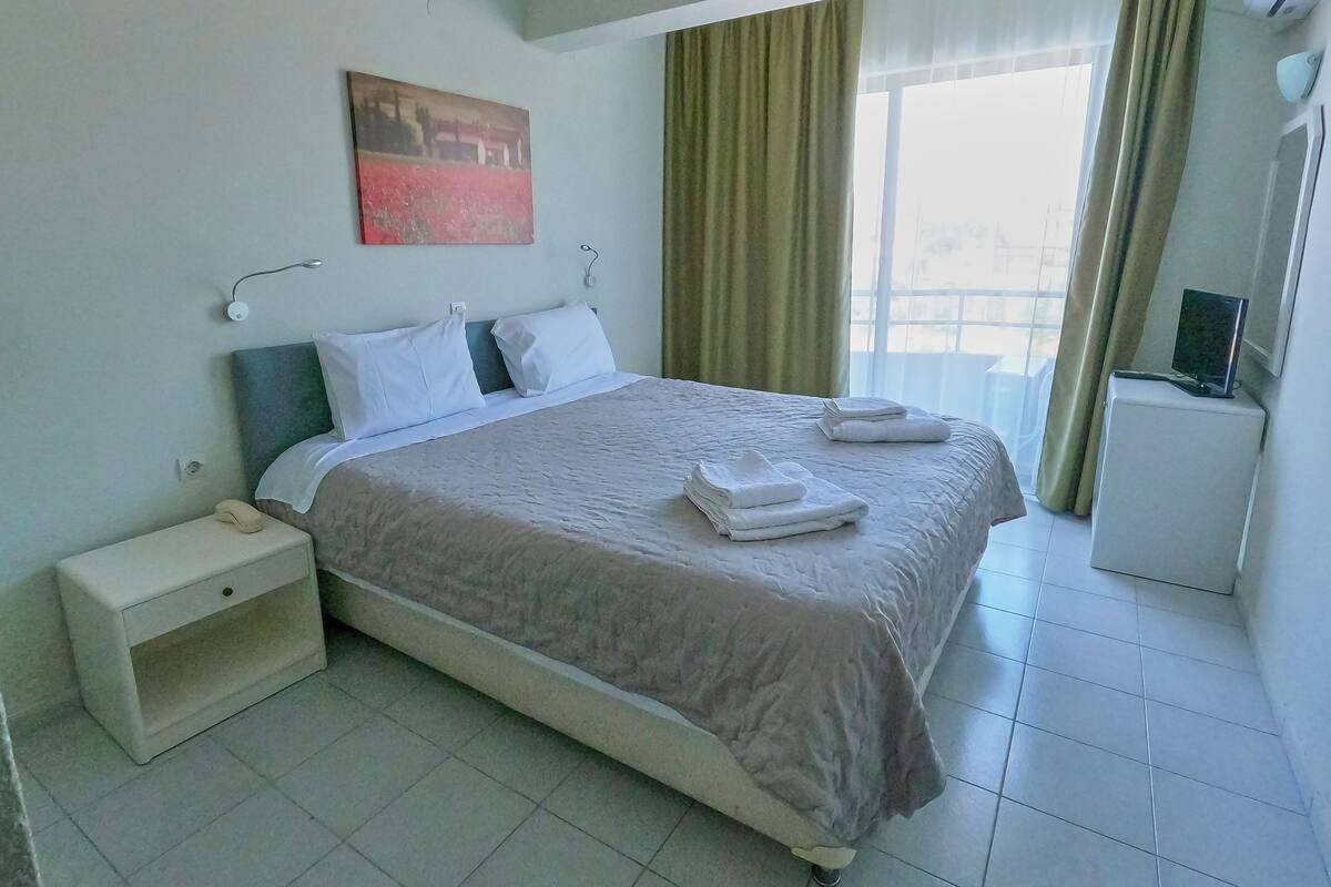 Family Quadruple Room, Garden View | Iron/ironing board, free WiFi