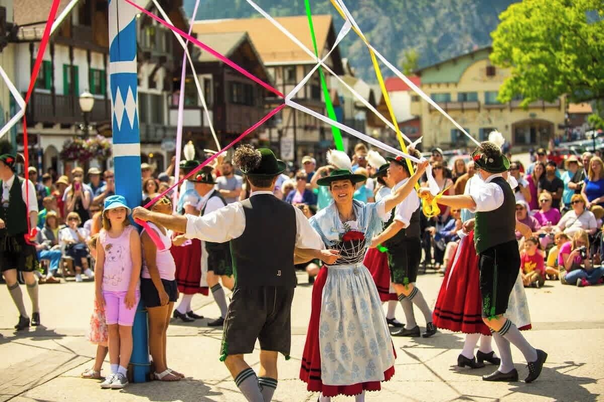 A traditional dance performance in an outdoor setting with spectators.