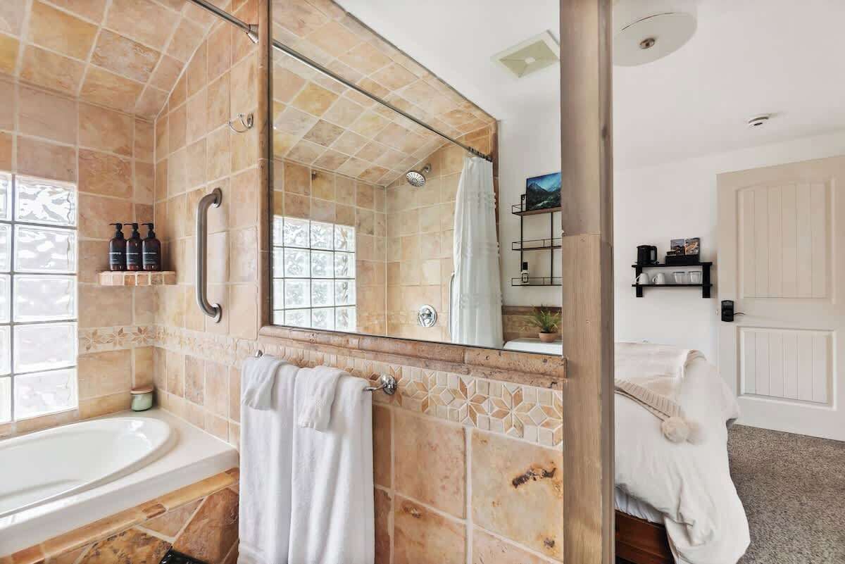 Shower, hair dryer, towels, shampoo