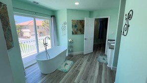 Shower, hair dryer, towels, shampoo