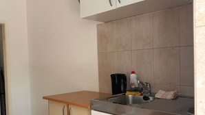 A kitchen with a countertop, sink, and cabinets. - Apartments Adriana Studio apartment 3 (Podaca)