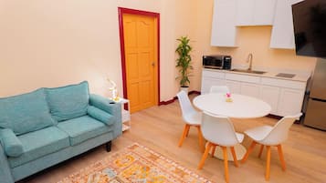 Luxury Suite, Balcony, Ocean View | Living area | Printers