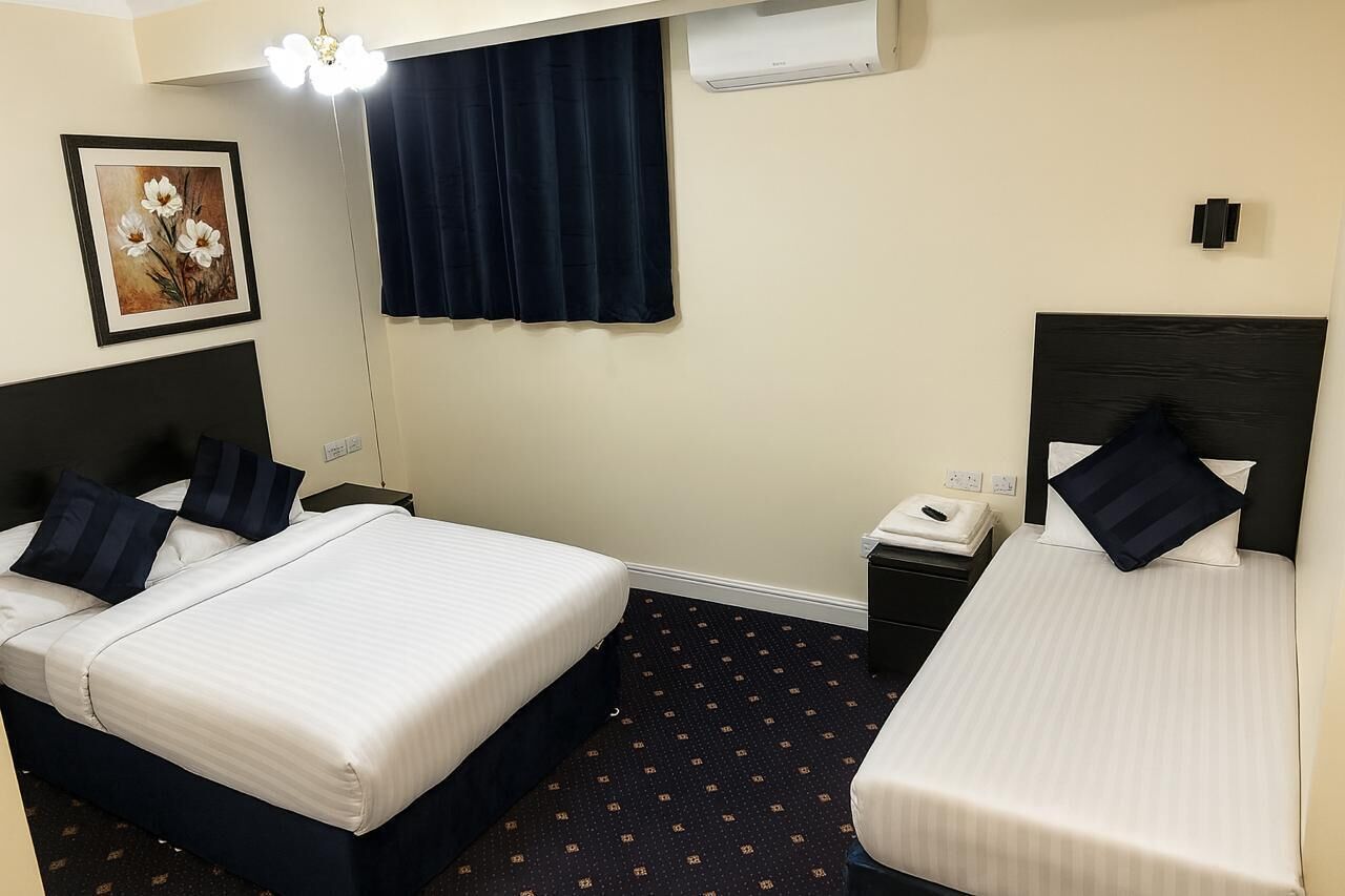 Family Triple Room, Garden View | Desk, free WiFi