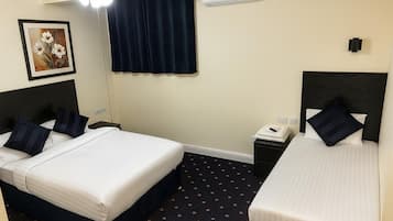 Family Triple Room, Garden View | Desk, free WiFi