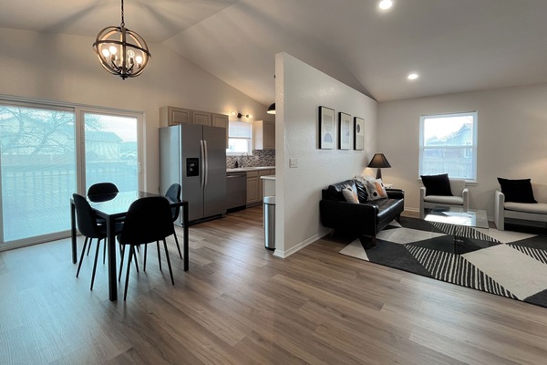 Upper level layout showing dining, kitchen, & living areas for easy group flow.