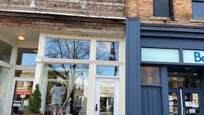 A storefront with large windows, a door, and a sign indicating '122 Studio'. - 124 Hurontario Unit 3 (Collingwood)