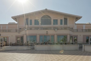 A two-story building with a balcony, large windows, and a tiled entrance area. - Shoni Bay Resort (Marsa Alam)