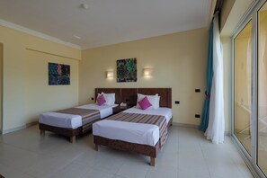 A hotel room with two beds, a painting on the wall, and a window with curtains. - Shoni Bay Resort (Marsa Alam)